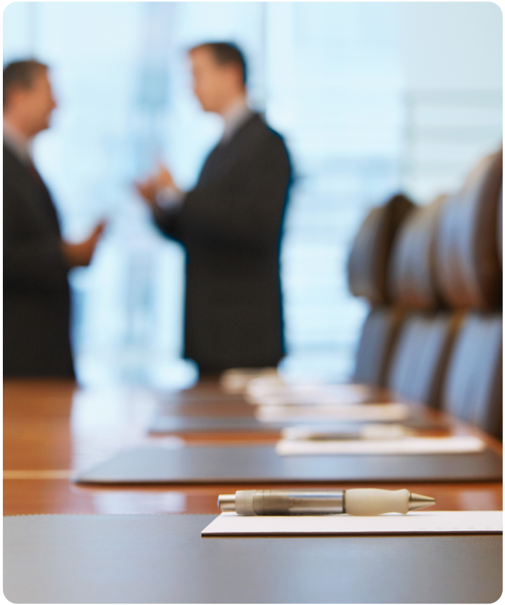 Medical Malpractice Case Lawyers discuss Medical Malpractice case while in background of an office image